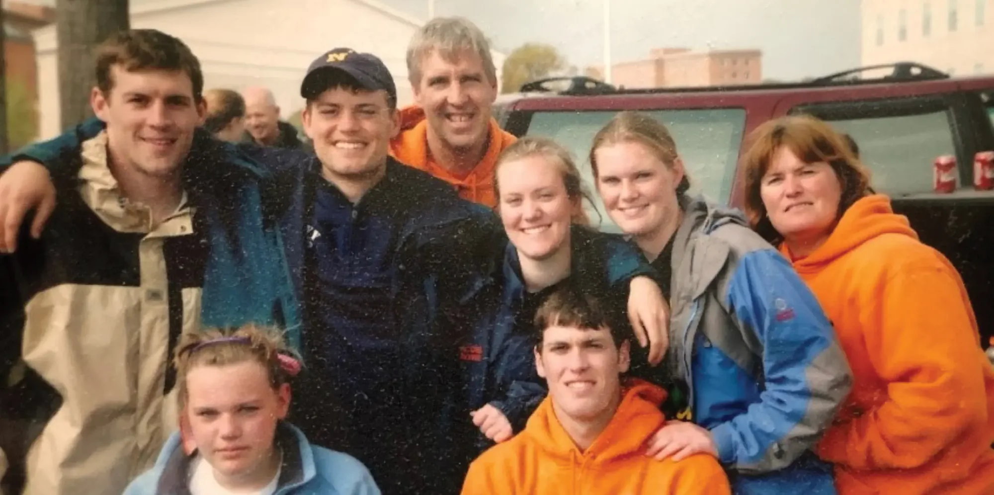 LT Brendan Looney ’04, USN, with siblings at a tailgate party during a Syracuse lacrosse game. First row: siblings Kellie and Billy; second row standing: Brendan, Stephen, Bridget, Erin and his mother, Maureen, who passed away in 2015.